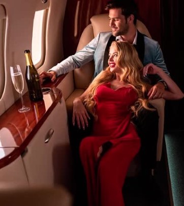 escort and client in a canal boat looking at the views