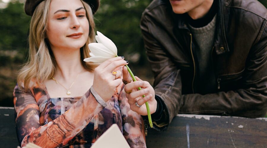 a couple giving eachother gifts as they enjoy a date